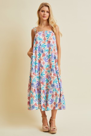 ED5445P<br/>PRINTED TO PERFECTION, THIS MULTI-COLORED TROPICAL MIDI DRESS IS FEATURED WITH SMOCKED NECK AND STRAPS THAT CAN BE TIED